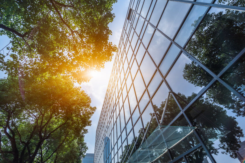 Modern office building with green leaves