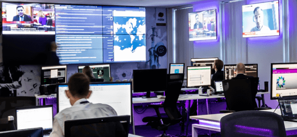 Mitie Intelligence Hub with employees sitting at desks with computers and big screens