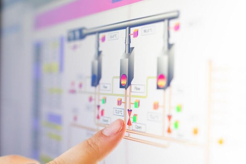 Finger pointing at digital reading for a Building Management System