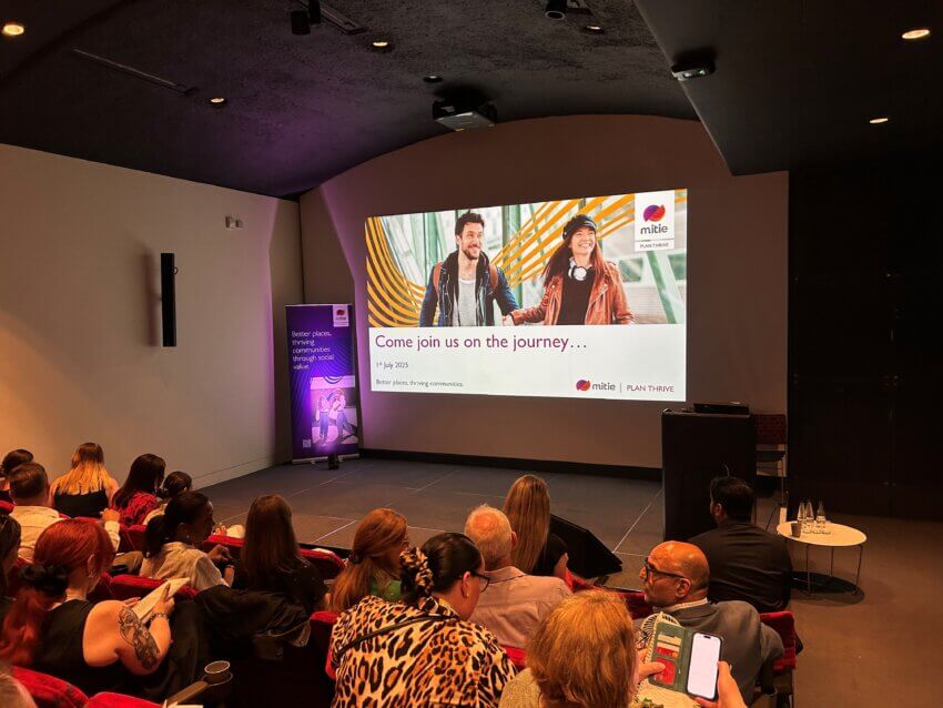 Crowd watching video on TV screen